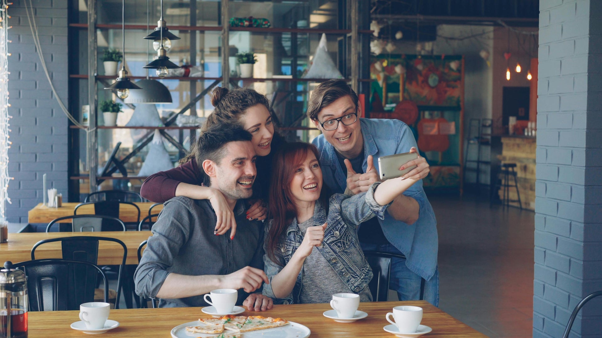 Group of friends taking a selfie in a casual setting